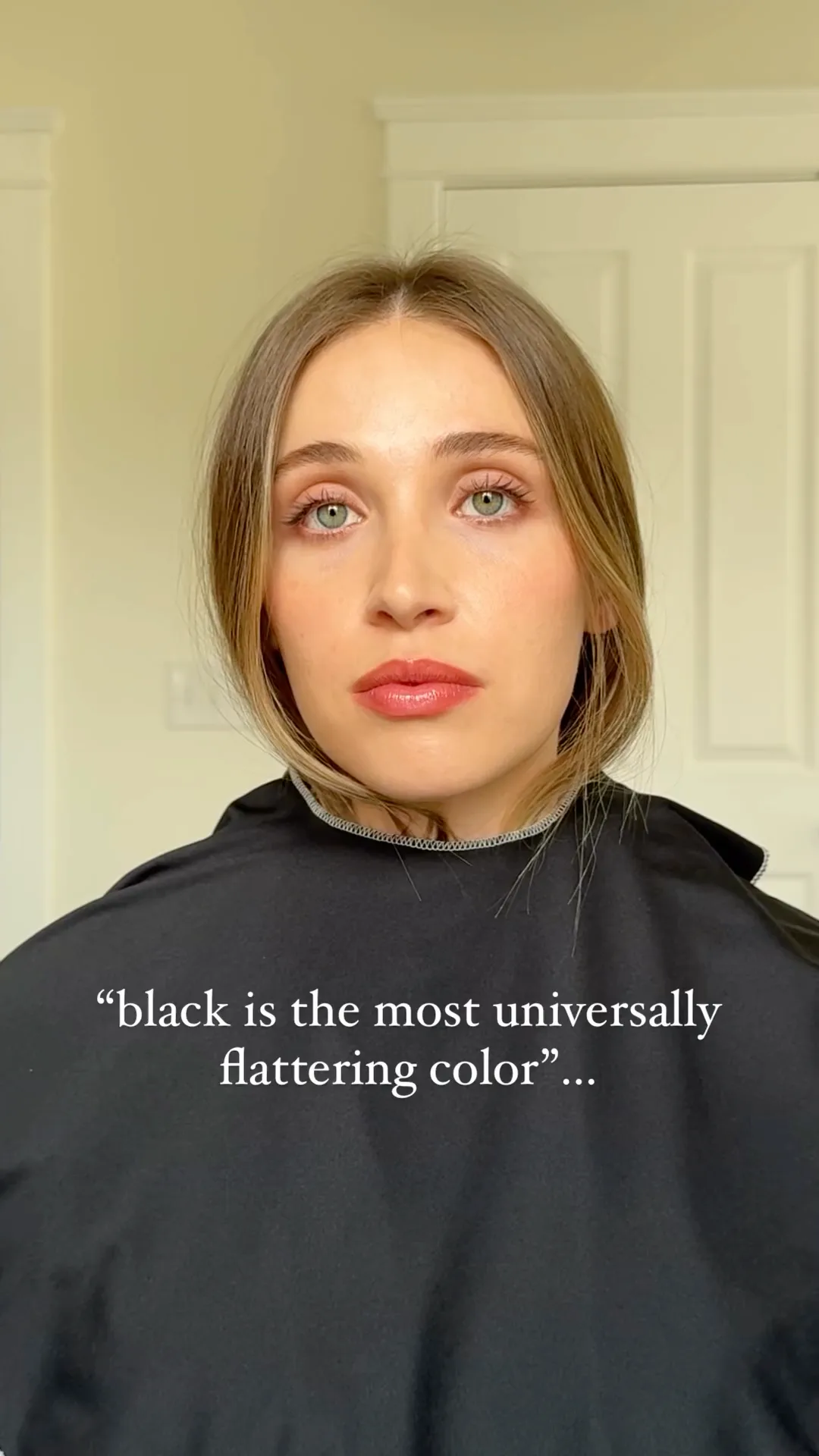 Before color analysis, a woman wears a black drape near her face.